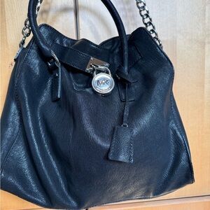 Michael Kors, black leather bag with silver lock